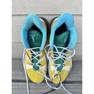 Size 16 Nike Kyrie 7 basketball shoe in the Yellow Strike/Green 1 World 1 People